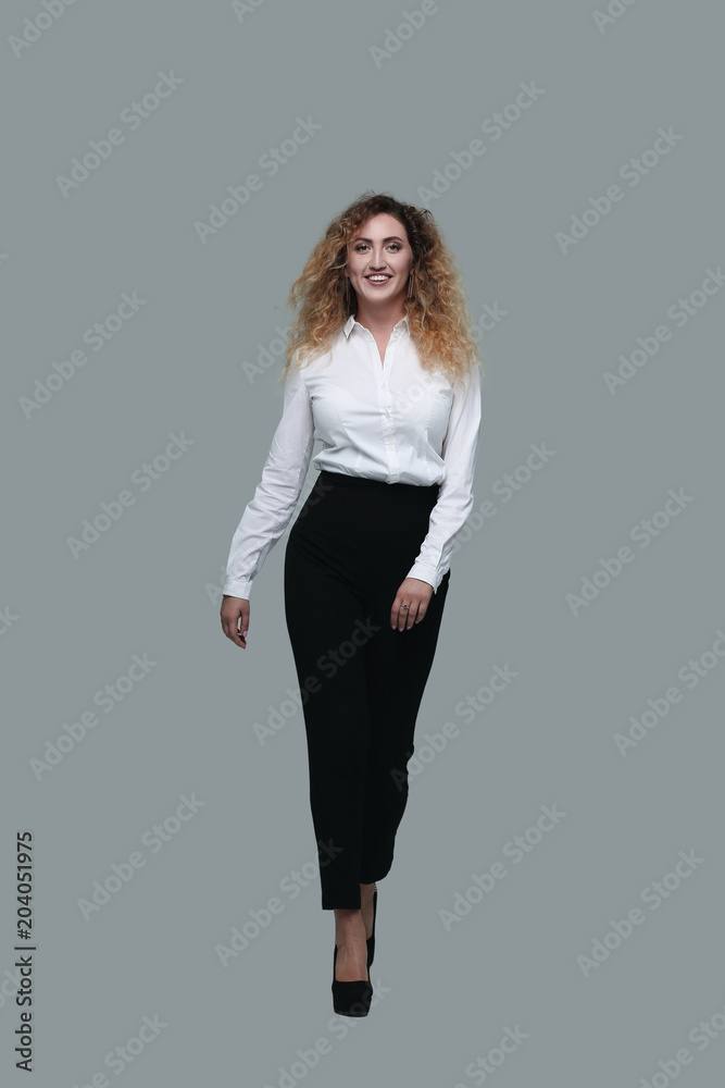 business woman striding confidently forward. business woman striding confidently forward.