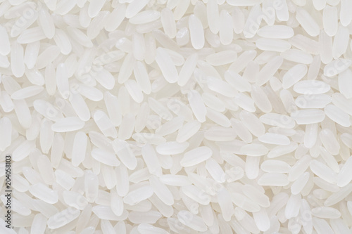 Background from long white rice. Closeup