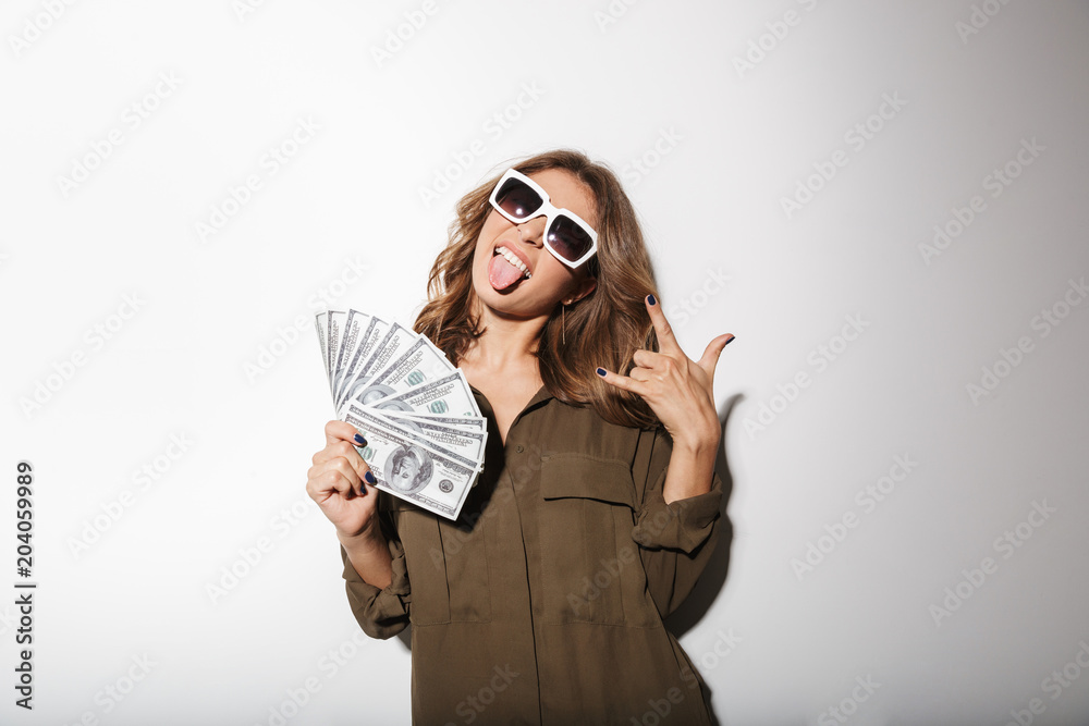 Portrait of a joyful young woman in sunglasses Portrait of a joyful young woman in sunglasses