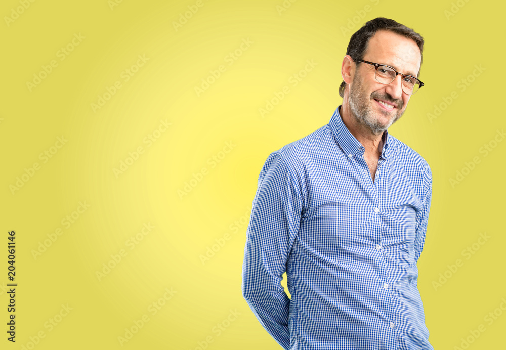 Handsome middle age man confident and happy with a big natural smile laughing, natural expression Handsome middle age man confident and happy with a big natural smile laughing, natural expression