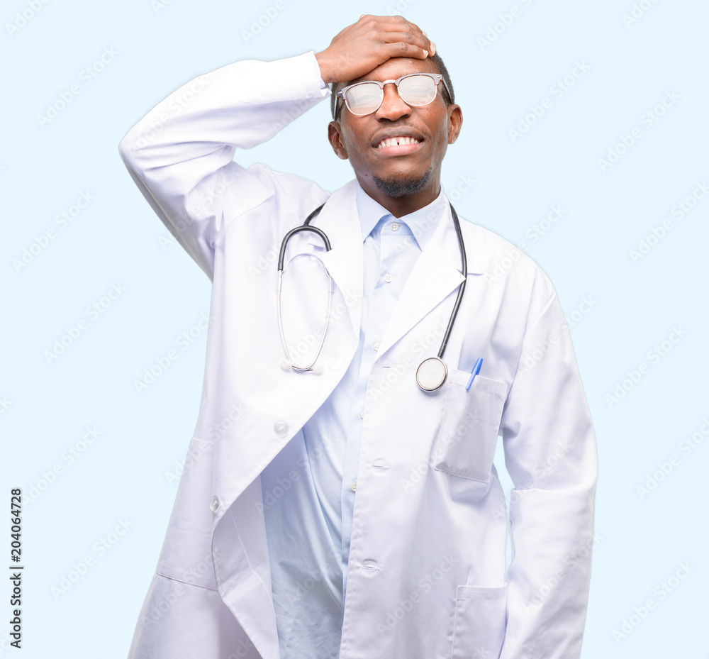 Young black doctor, medical professional terrified and nervous expressing anxiety and panic gesture, overwhelmed Young black doctor, medical professional terrified and nervous expressing anxiety and panic gesture, overwhelmed