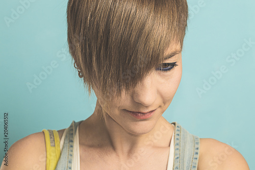 Portrait of a girl with short hair and serious expression