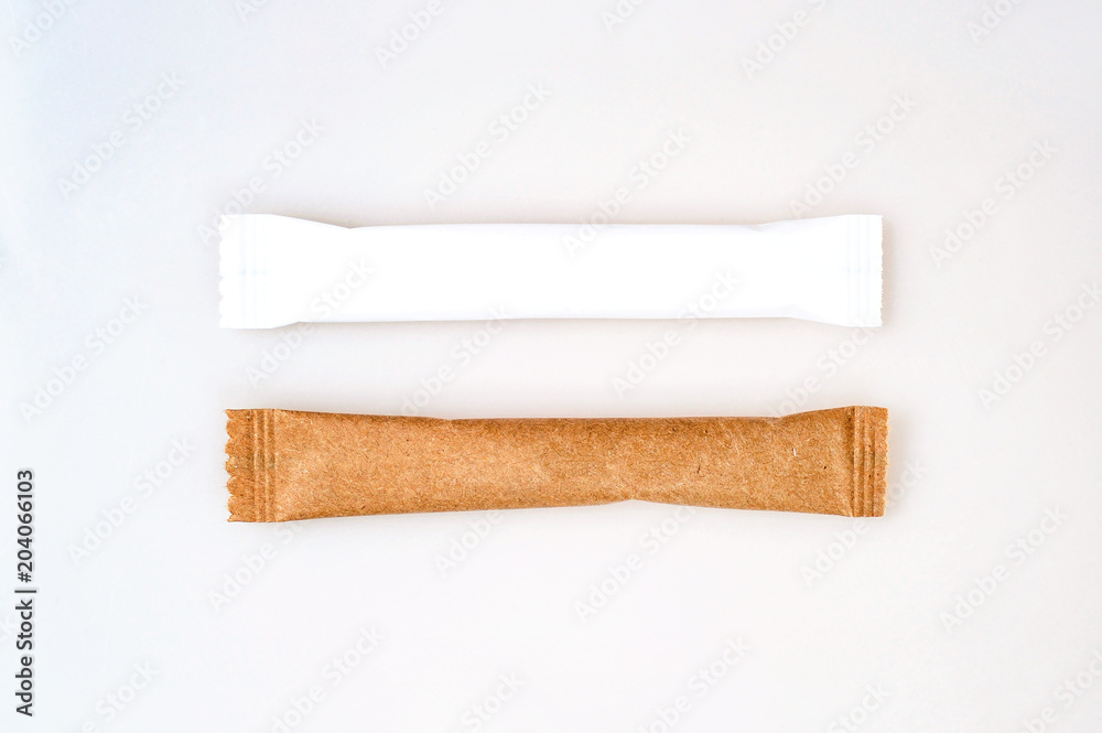 Brown and white paper sachets isolated on white background Brown and white paper sachets isolated on white background