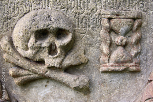 Skull and Hourglass - the symbol of the transience of human life photo