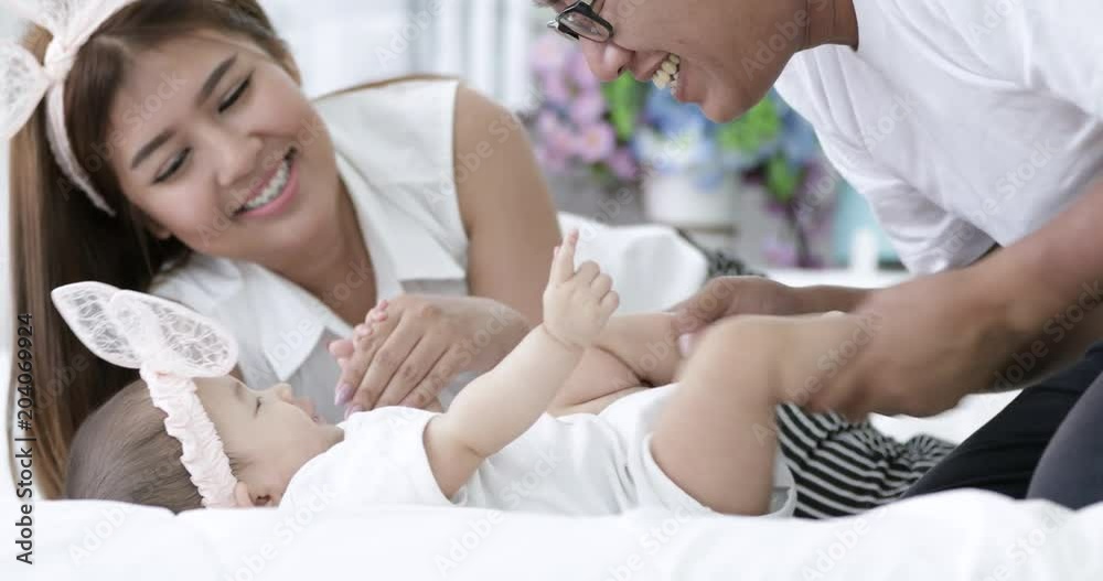 Happy asian family baby with parent make fun at home with smile face. Happy asian family baby with parent make fun at home with smile face.