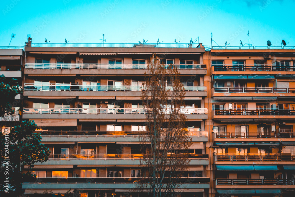 orange apartment complex in the afternoon light orange apartment complex in the afternoon light