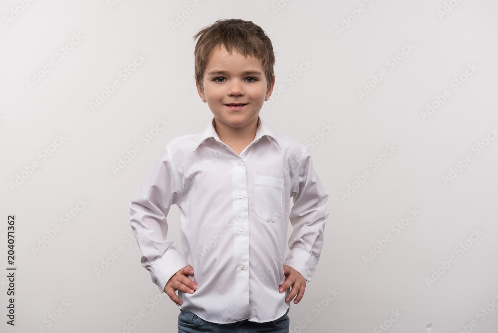 Pre school age. Nice smart boy smiling while looking at you Pre school age. Nice smart boy smiling while looking at you