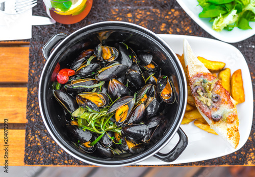 plate with tasty mussels, close up view