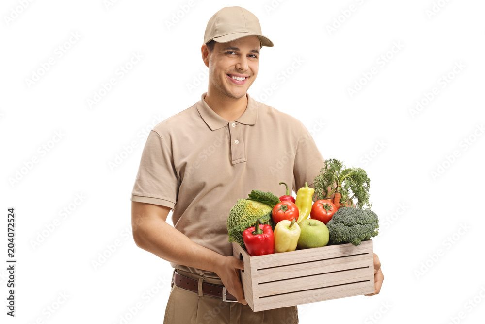 Delivery man holding a crate filled with groceries Delivery man holding a crate filled with groceries