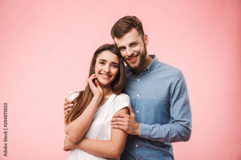 Fototapeta Portrait of a beautiful young couple hugging
