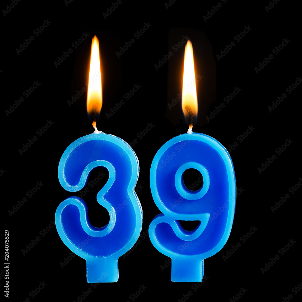 Burning birthday candles in the form of 39 thirty nine for cake isolated on black background. Burning birthday candles in the form of 39 thirty nine for cake isolated on black background.