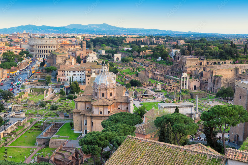 Rome skyline. Beautiful aerial view of Roman Forum and Colosseum in Rome, Italy.