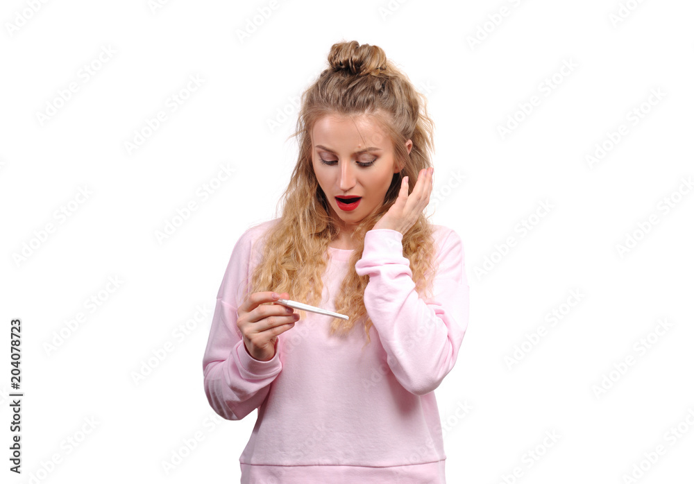 Happy woman showing a positive pregnancy test Happy woman showing a positive pregnancy test