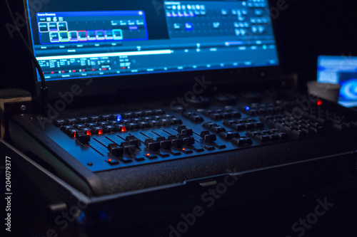 Soundman working on the mixing console.