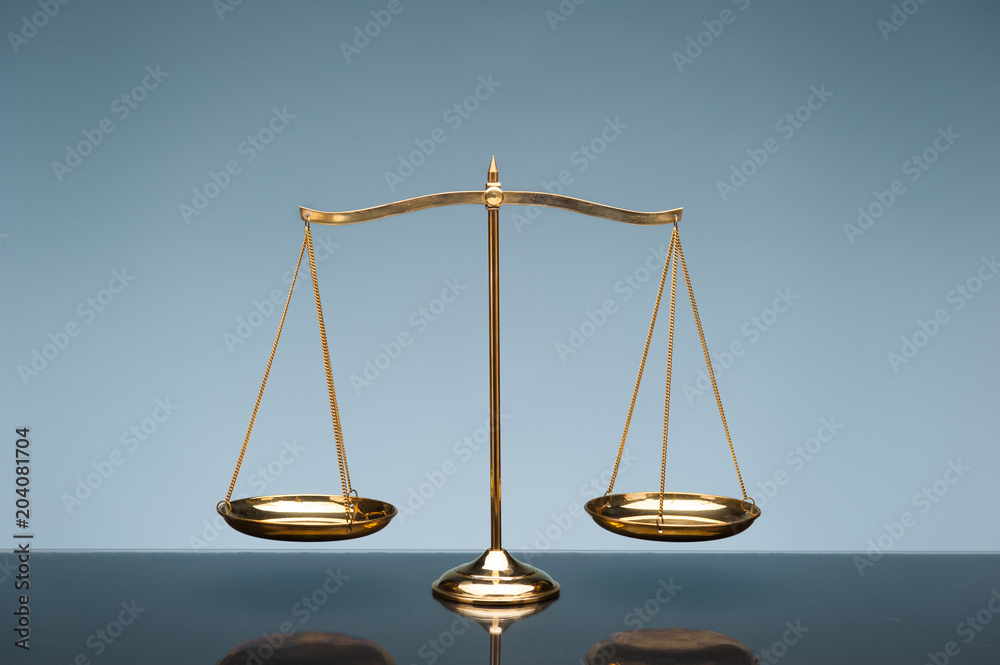 Balance scale on blue background Balance scale on blue background