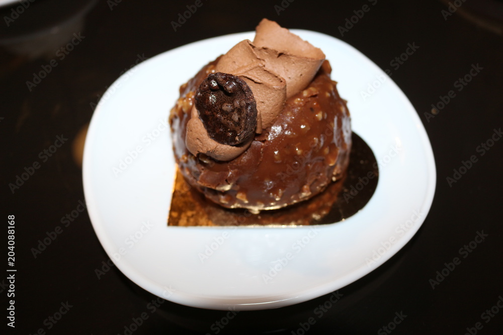 Chocolate cake decorated with cream and chocolate Chocolate cake decorated with cream and chocolate