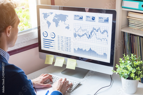 Businessman analyzing Business Analytics dashboard with KPI, financial metrics, fintech photo