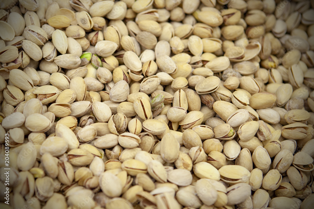 Pistachio nuts background. View from above.