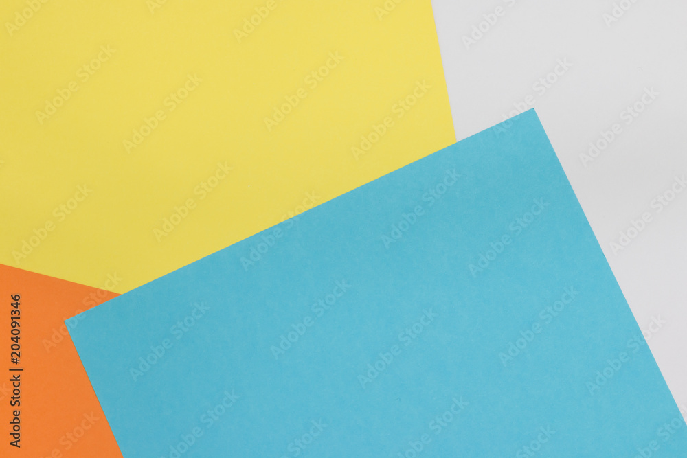 Colorful paper background on top view . (blue, white, yellow, orange) Colorful paper background on top view . (blue, white, yellow, orange)