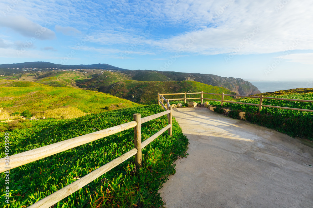 beautiful panorama of mountains and sea which opens from the observation deck with a wooden fence