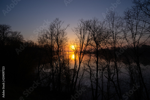 Sunrise on the river. Early spring