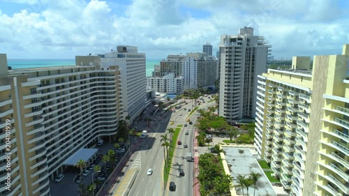 Aerial drone video shot Miami Beach upscale condominiums on Collins Avenue photo