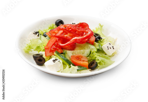 Bowl of freah greek salad isolated on white background
