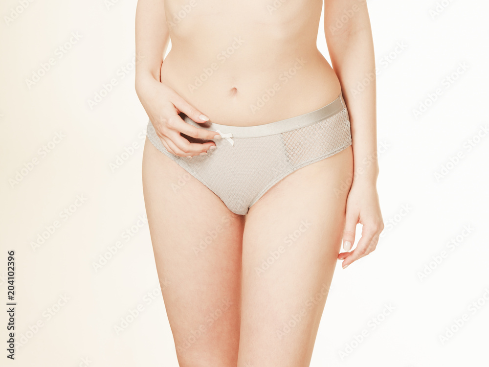 Slim woman in grey panties underwear