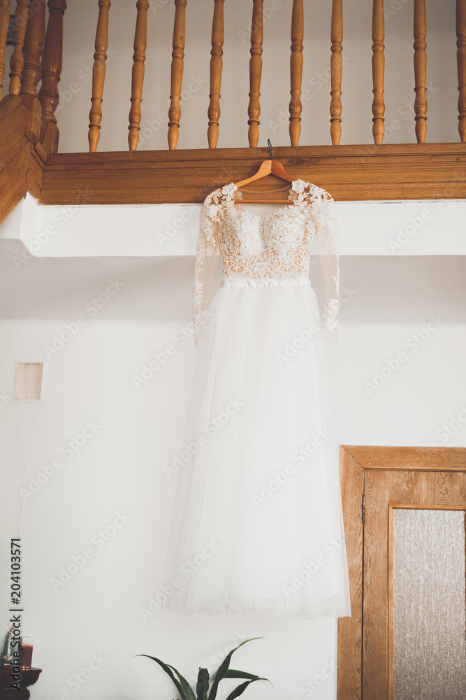 The perfect wedding dress in the room of the bride The perfect wedding dress in the room of the bride
