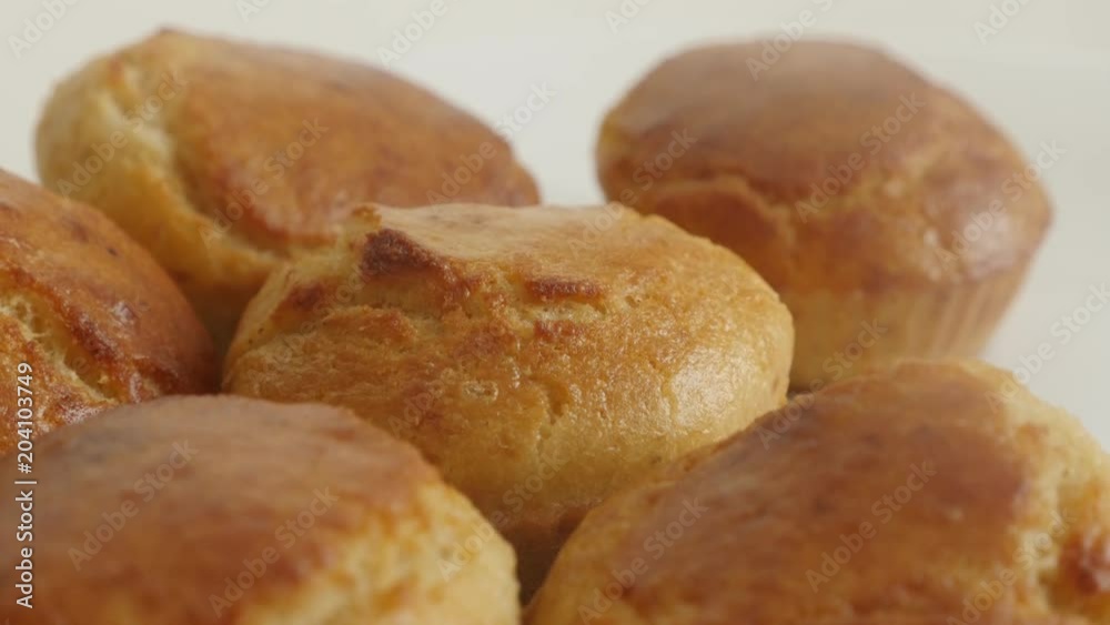 Shallow DOF cornbread prepared as a muffin slow tilt footage - Tasty cornmeal on white plate close-up Shallow DOF cornbread prepared as a muffin slow tilt footage - Tasty cornmeal on white plate close-up