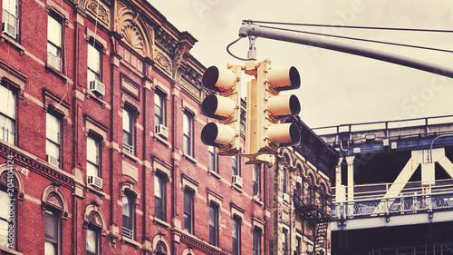 Retro toned picture of New York City traffic lights, selective focus, USA.
