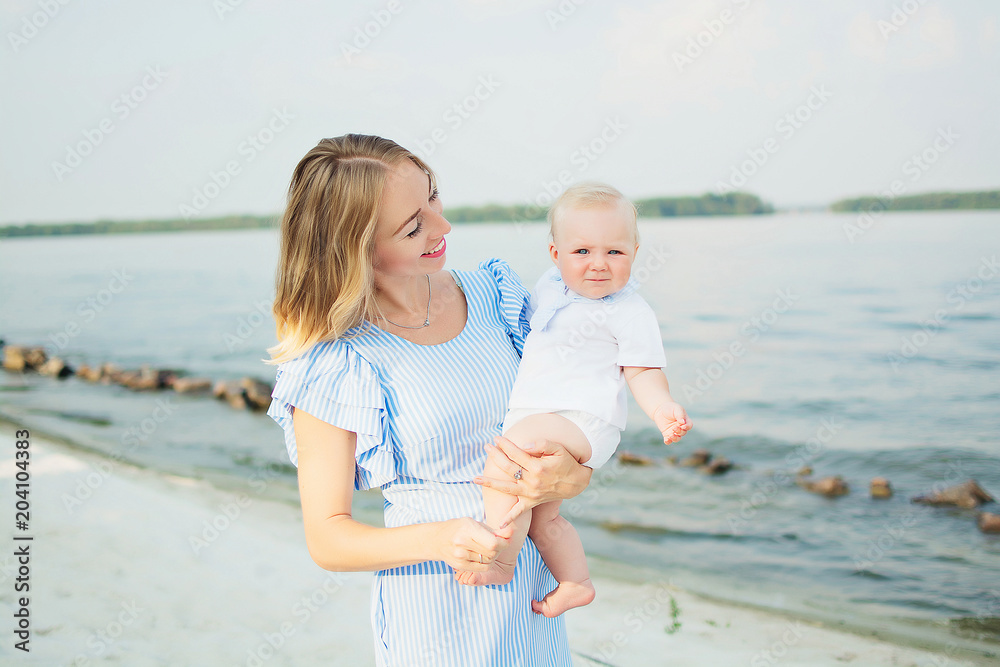 Mom and daughter on the beach in golybysh dresses.  mothers Day