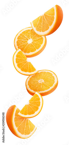Slices orange flying in the air