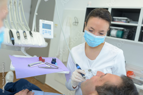 Dentist working on patient s teeth