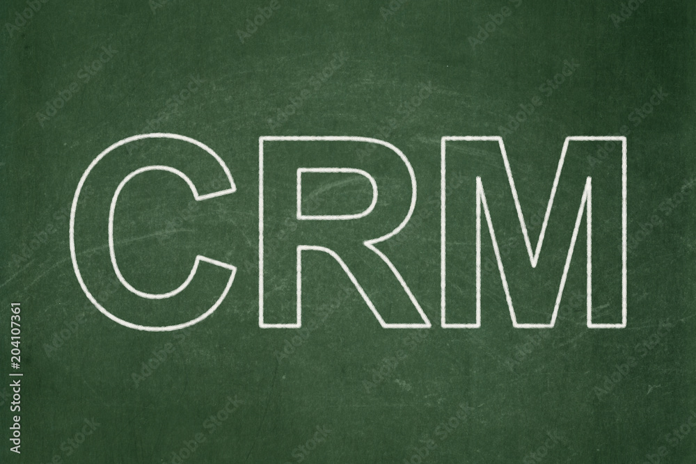 Finance concept: text CRM on Green chalkboard background Finance concept: text CRM on Green chalkboard background