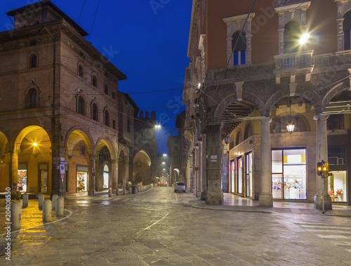 Bologna - The square Piazza della Mercanzia at dusk.