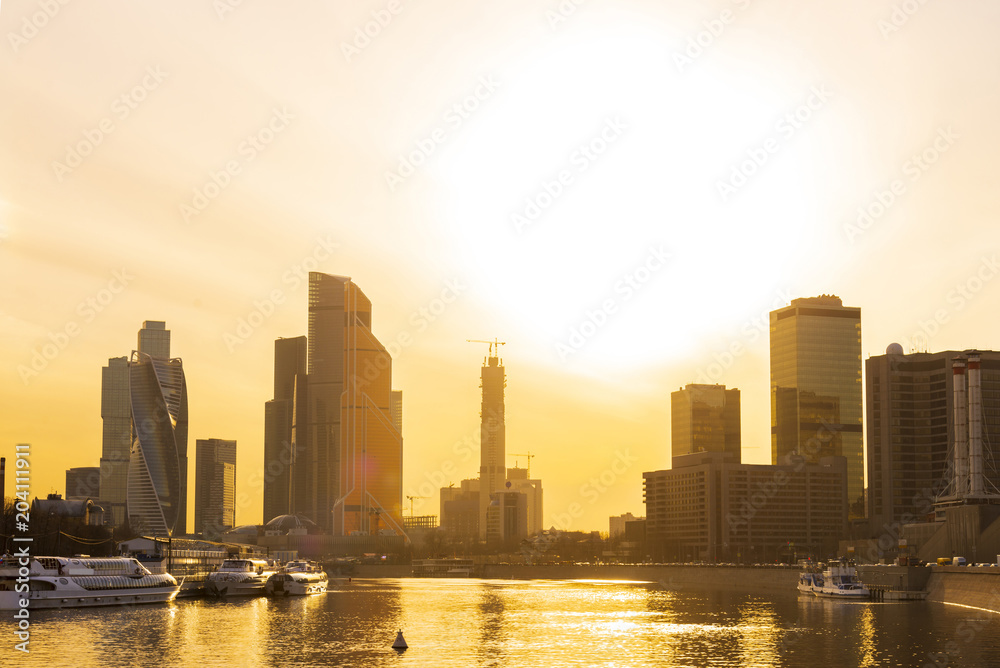 Obraz premium Cityscape and Landscape of downtown Moscow with Modern skyscrapers, office building and Moskva river over Sunrise sky, Moscow City, Russia