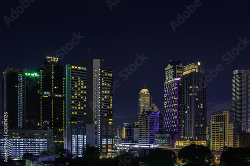 Cityscape at night in bangkok with tower and road, twilight sky