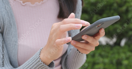 Photography Woman working on smart phone at outdoor