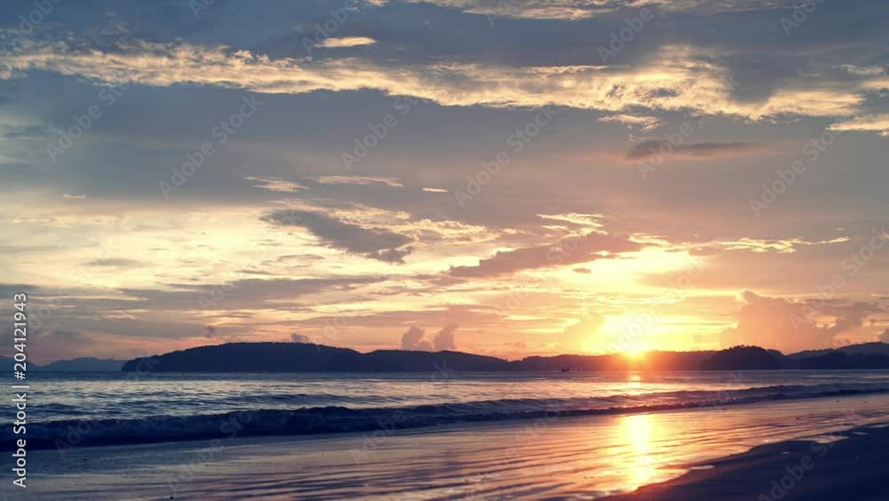 Amazing panoramic landscape with beautiful dramatic sky and sun setting over Andaman sea, Thailand Amazing panoramic landscape with beautiful dramatic sky and sun setting over Andaman sea, Thailand