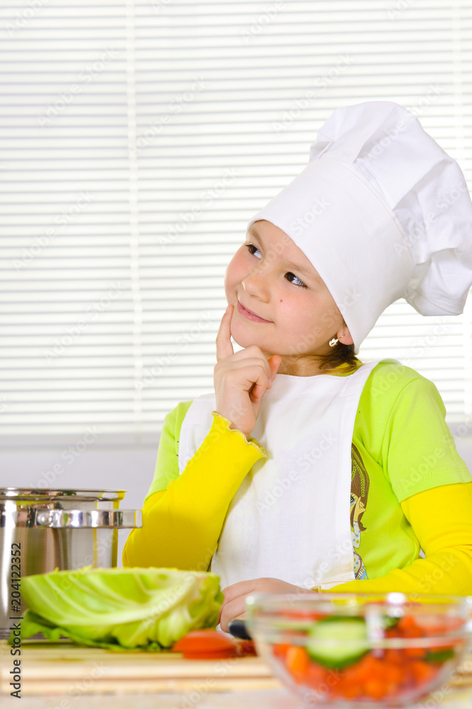 girl wearing chef uniform cooking 