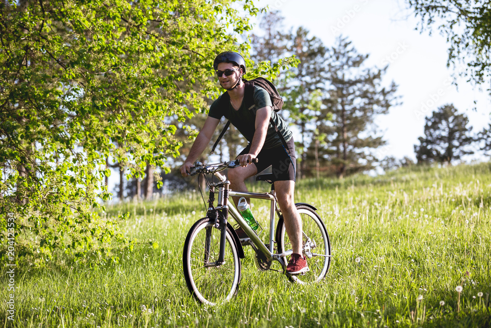 Fototapeta premium Young man drive his bike in nature