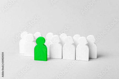 Person stands out from the crowd. Leader in the business team. Concept