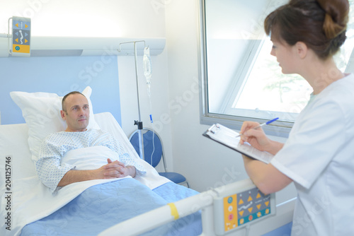 asking the patient how he is feeling