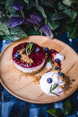 Delicious homemade cheesecake with berry sauce.