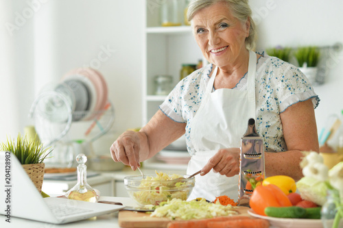 Grandmother cook in the kitchen