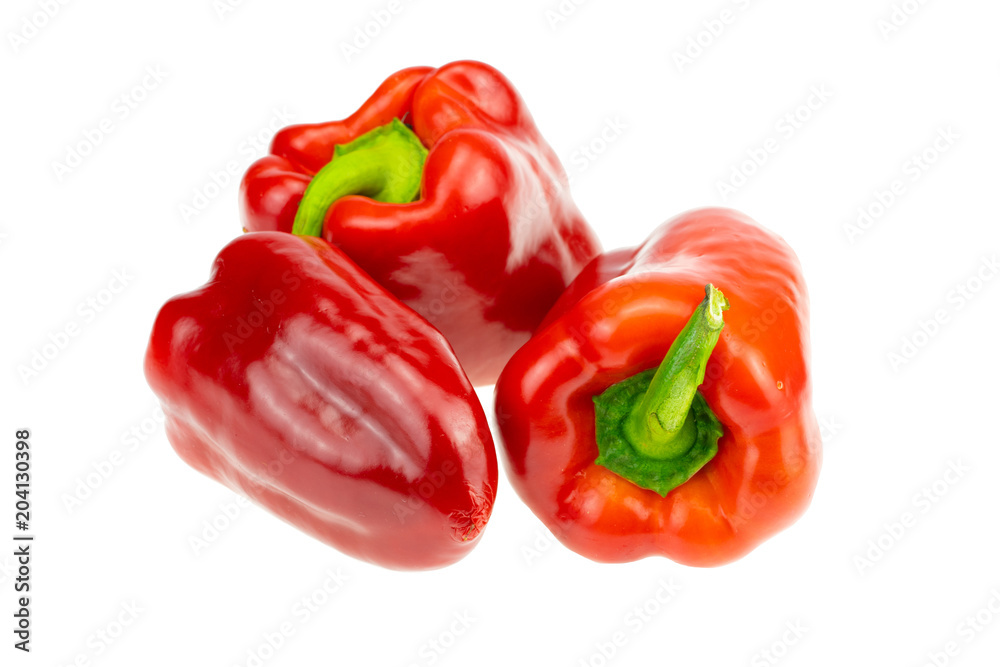 Three Red pepper. Closeup. Isolated on white background.Concept Health. Three Red pepper. Closeup. Isolated on white background.Concept Health.