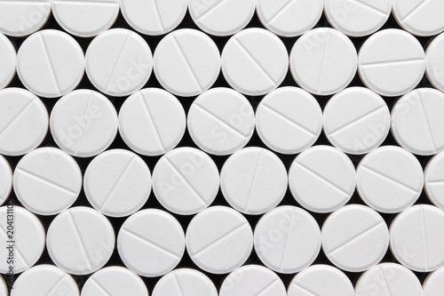 texture, background, of white pills on a black background photo