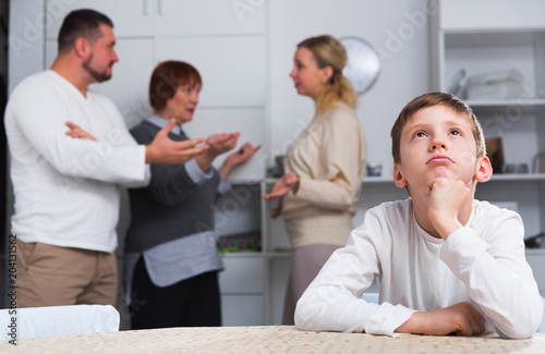 Upset son suffering from parental arguing