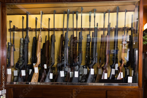 Gun store interior with rifles